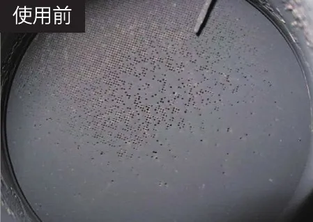 デュアルクリーナーの使用前の DP マフラー。すすで目がふさがっている